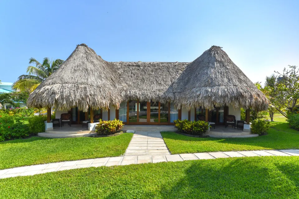 2 Bedroom Luxury Villa exterior with thatched roof at Victoria House Resort & Spa.