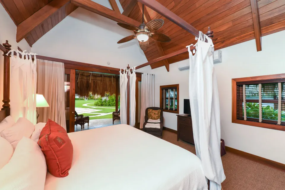 2 Bedroom Luxury Villa bedroom opening to the lawn at Victoria House Resort & Spa.