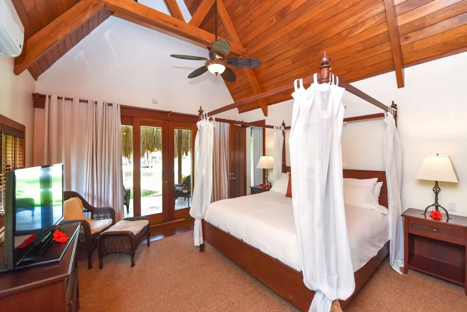 2 Bedroom Luxury Villa bedroom with four-poster bed at Victoria House Resort & Spa.