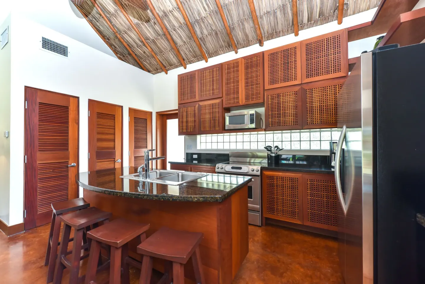 2 Bedroom Luxury Villa kitchen with island seating at Victoria House Resort & Spa.