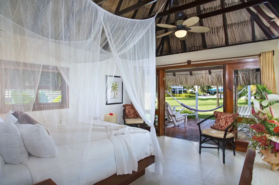 Casita king bed and veranda doors at Victoria House Resort & Spa.