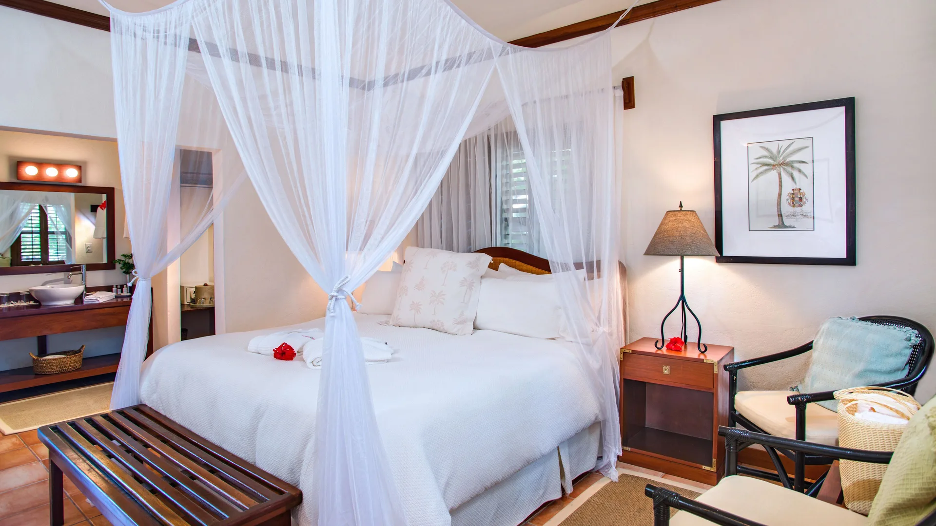 Palmetto Room canopy bed and vanity at Victoria House Resort & Spa.