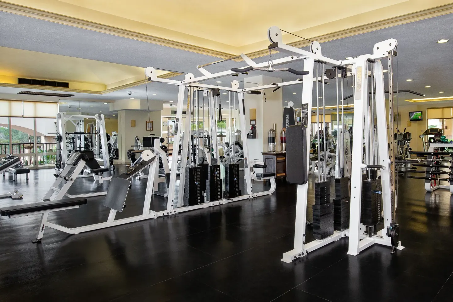 Cable machines and strength equipment in the gym at Villa del Arco Beach Resort & Spa Cabo San Lucas.
