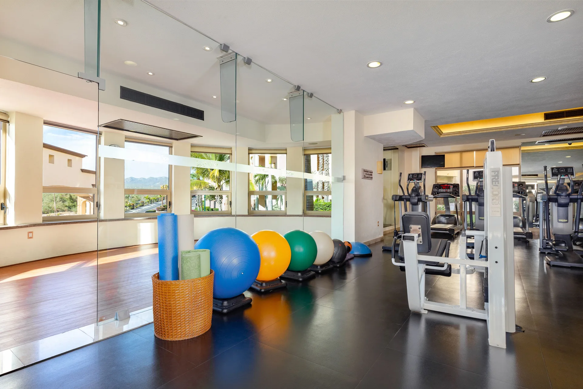 Exercise balls and gym equipment beside a studio area at Villa del Arco Beach Resort & Spa Cabo San Lucas.