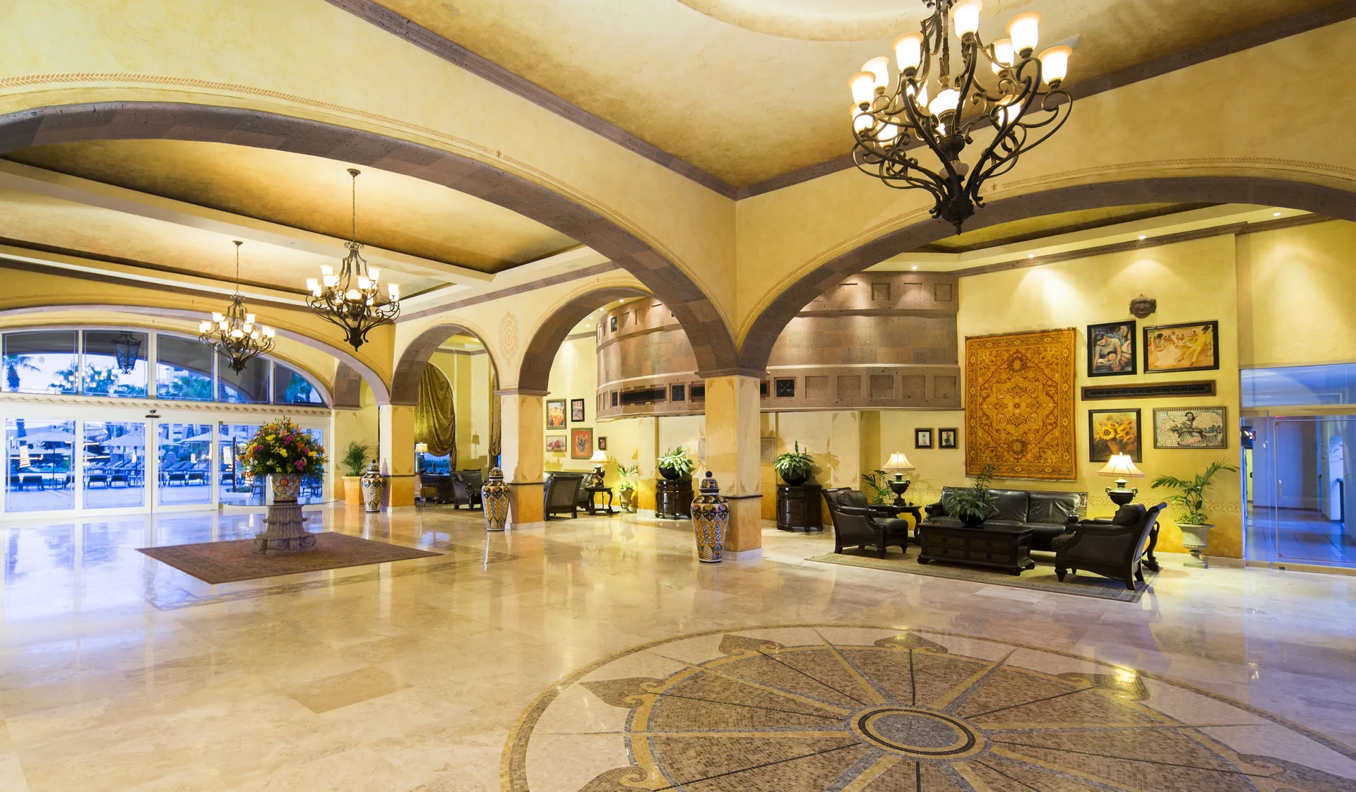 Grand lobby with arches and chandeliers at Villa del Arco Beach Resort & Spa Cabo San Lucas.
