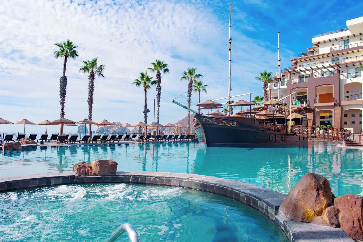 Whirlpool and main pool with ship feature at Villa del Arco Beach Resort & Spa Cabo San Lucas.
