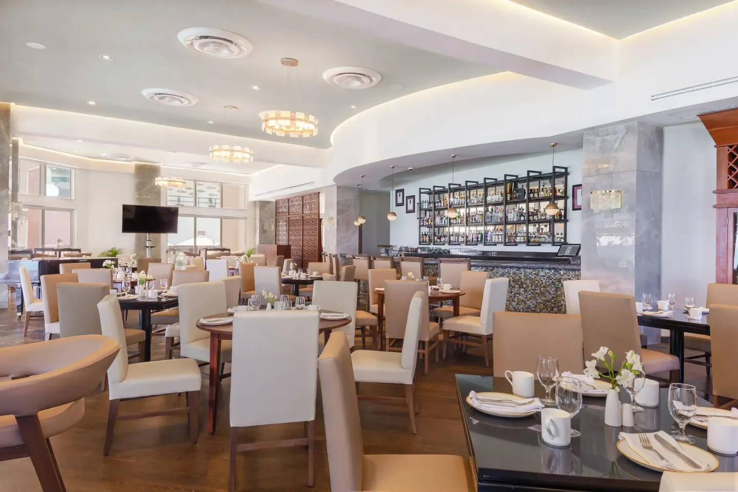 Indoor dining room and bar at Villa del Arco Beach Resort & Spa Cabo San Lucas.
