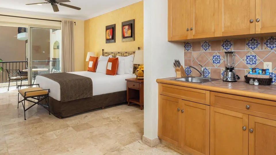 Deluxe Studio Garden View king bed and kitchenette at Villa del Arco Beach Resort & Spa Cabo San Lucas.
