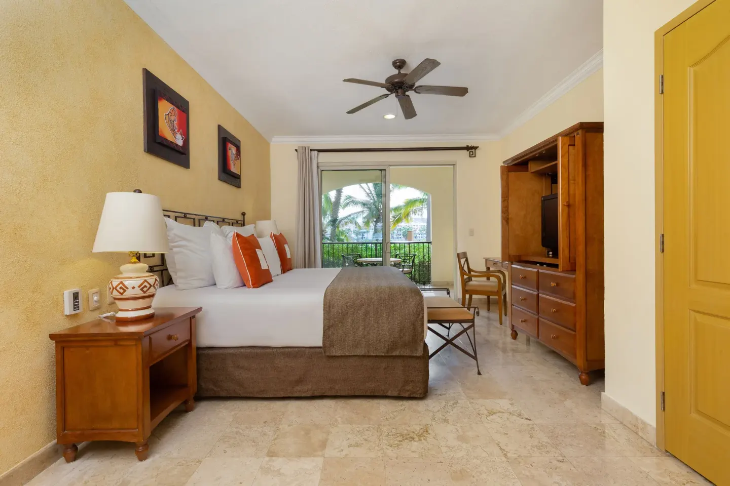 Deluxe Studio Garden View bedroom with king bed and balcony at Villa del Arco Beach Resort & Spa Cabo San Lucas.