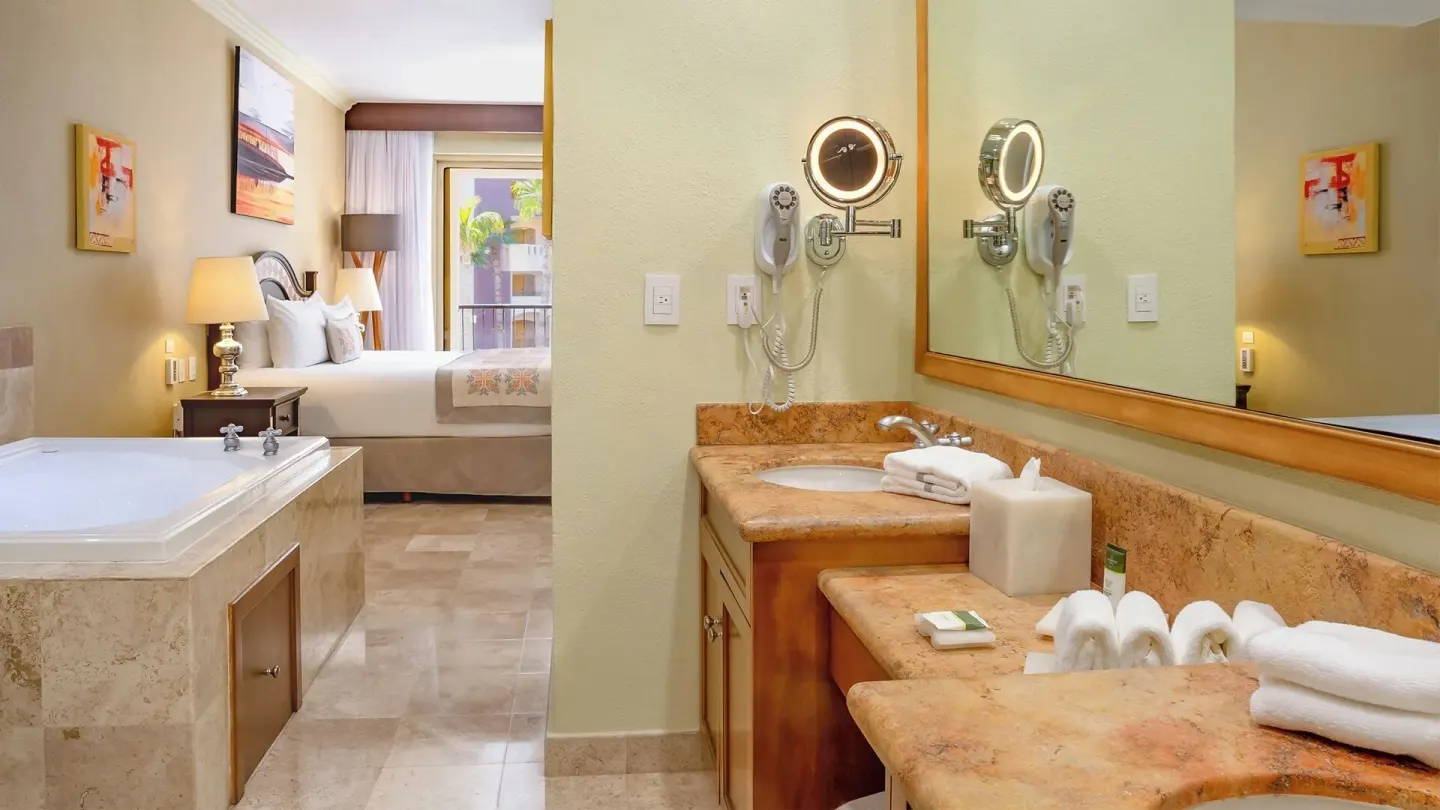 One Bedroom Suite Garden View bath and bedroom at Villa del Arco Beach Resort & Spa Cabo San Lucas.