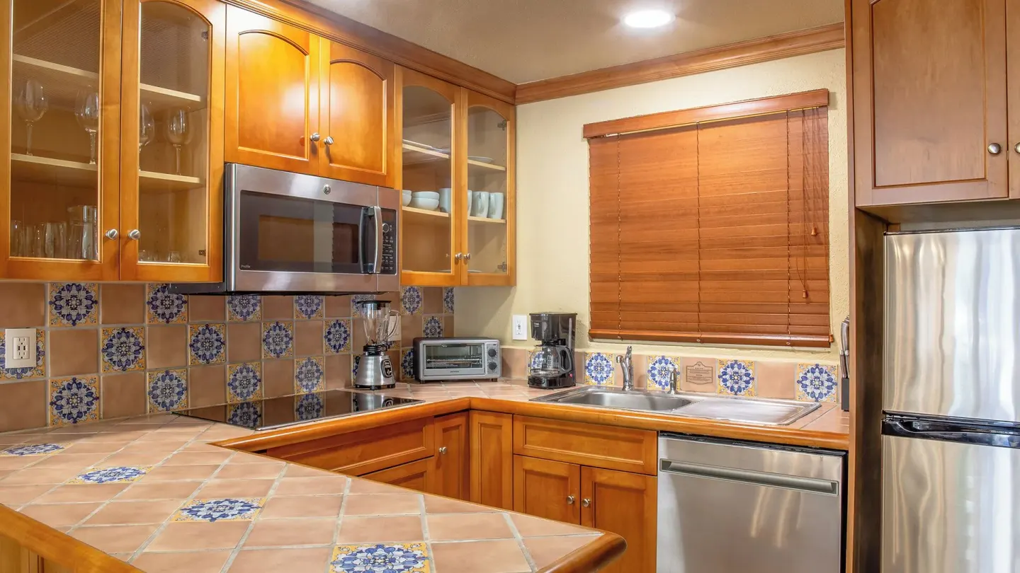 One Bedroom Suite Garden View kitchen with tile counters at Villa del Arco Beach Resort & Spa Cabo San Lucas.