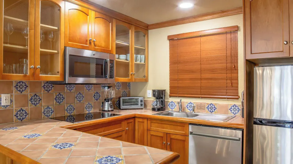 One Bedroom Suite Garden View kitchen with tile counters at Villa del Arco Beach Resort & Spa Cabo San Lucas.