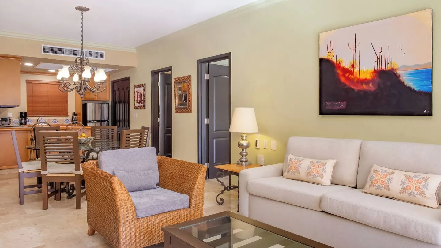 One Bedroom Suite Garden View sofa and dining space at Villa del Arco Beach Resort & Spa Cabo San Lucas.