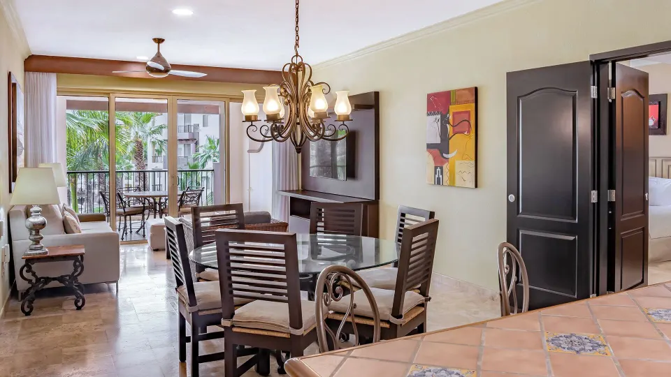 Two Bedroom Suite dining area with balcony at Villa del Arco Beach Resort & Spa Cabo San Lucas.