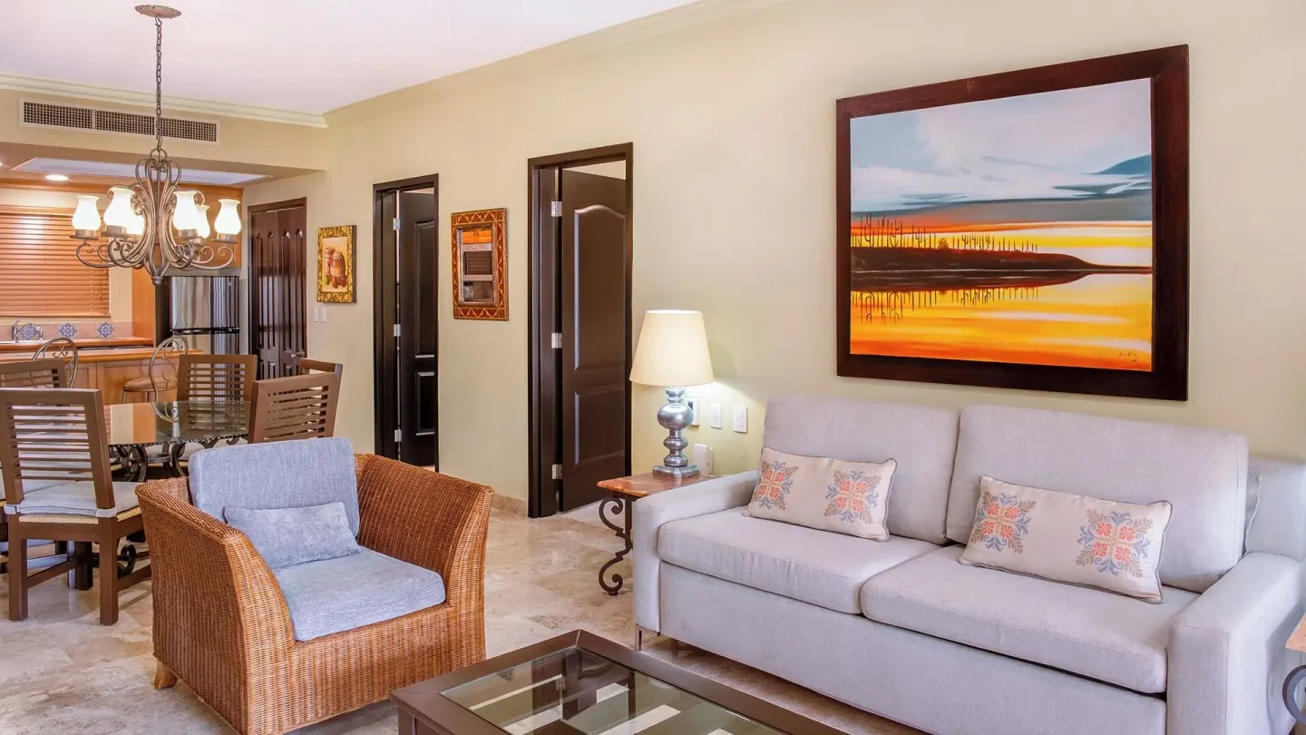 Two Bedroom Suite sofa and dining area at Villa del Arco Beach Resort & Spa Cabo San Lucas.