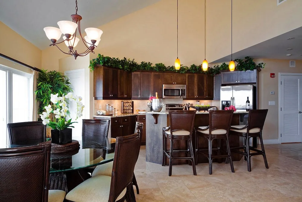 Open kitchen and dining area with bar seating at Villa del Mar.