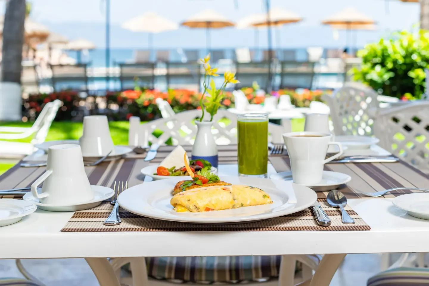 Breakfast table by the beach at Villa del Palmar Beach Resort and Spa, Puerto Vallarta.