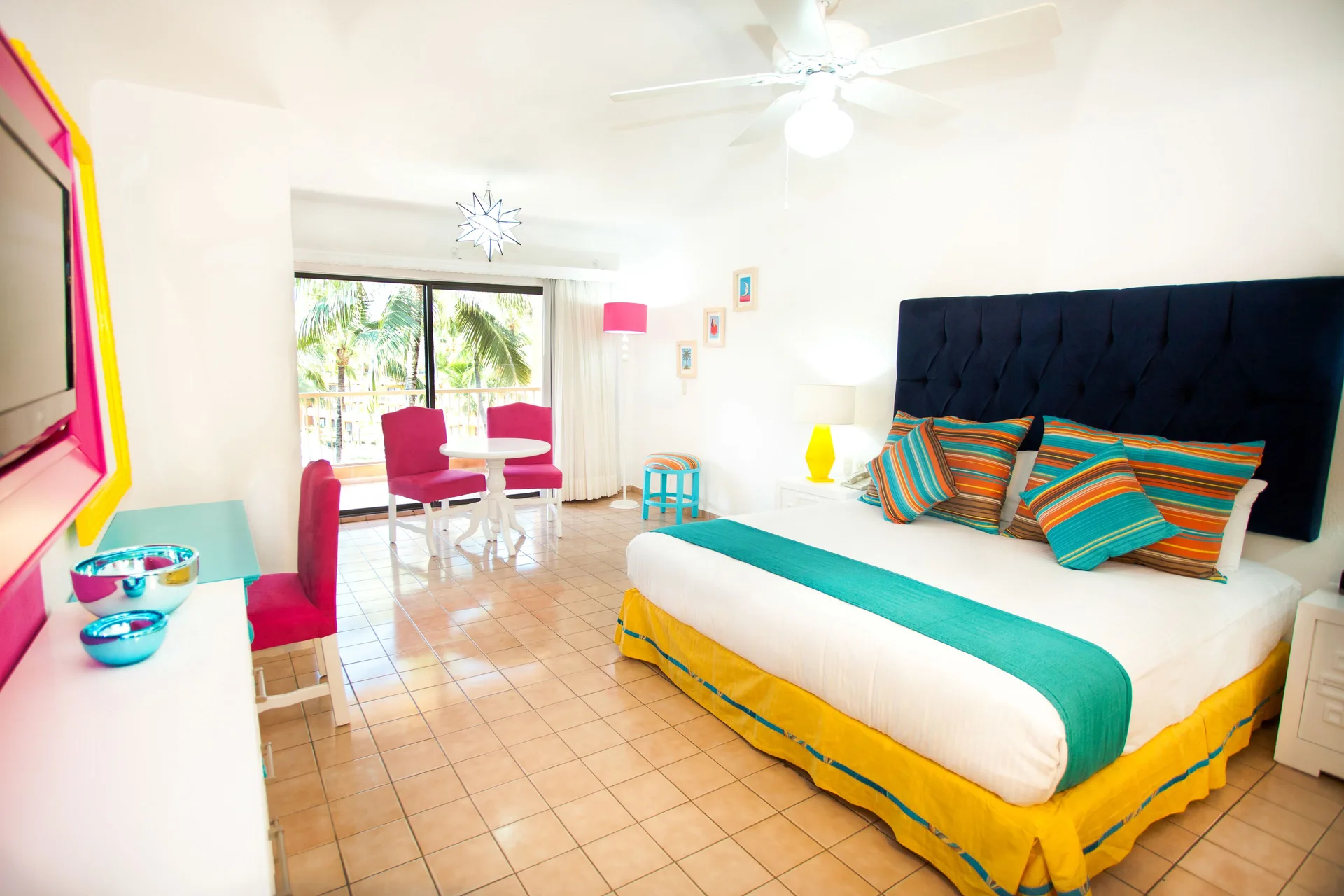 Junior Suite king bed and sitting area at Villa del Palmar Beach Resort and Spa, Puerto Vallarta.