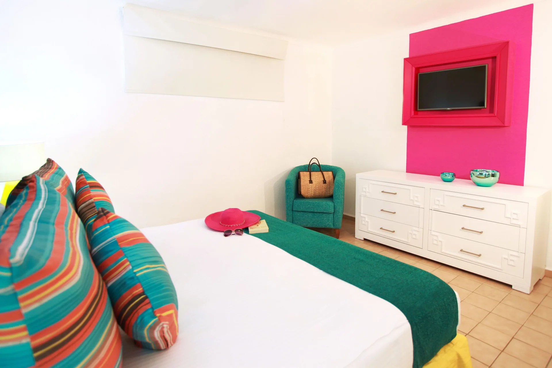 Superior One Bedroom Suite bedroom with TV at Villa del Palmar Beach Resort and Spa, Puerto Vallarta.