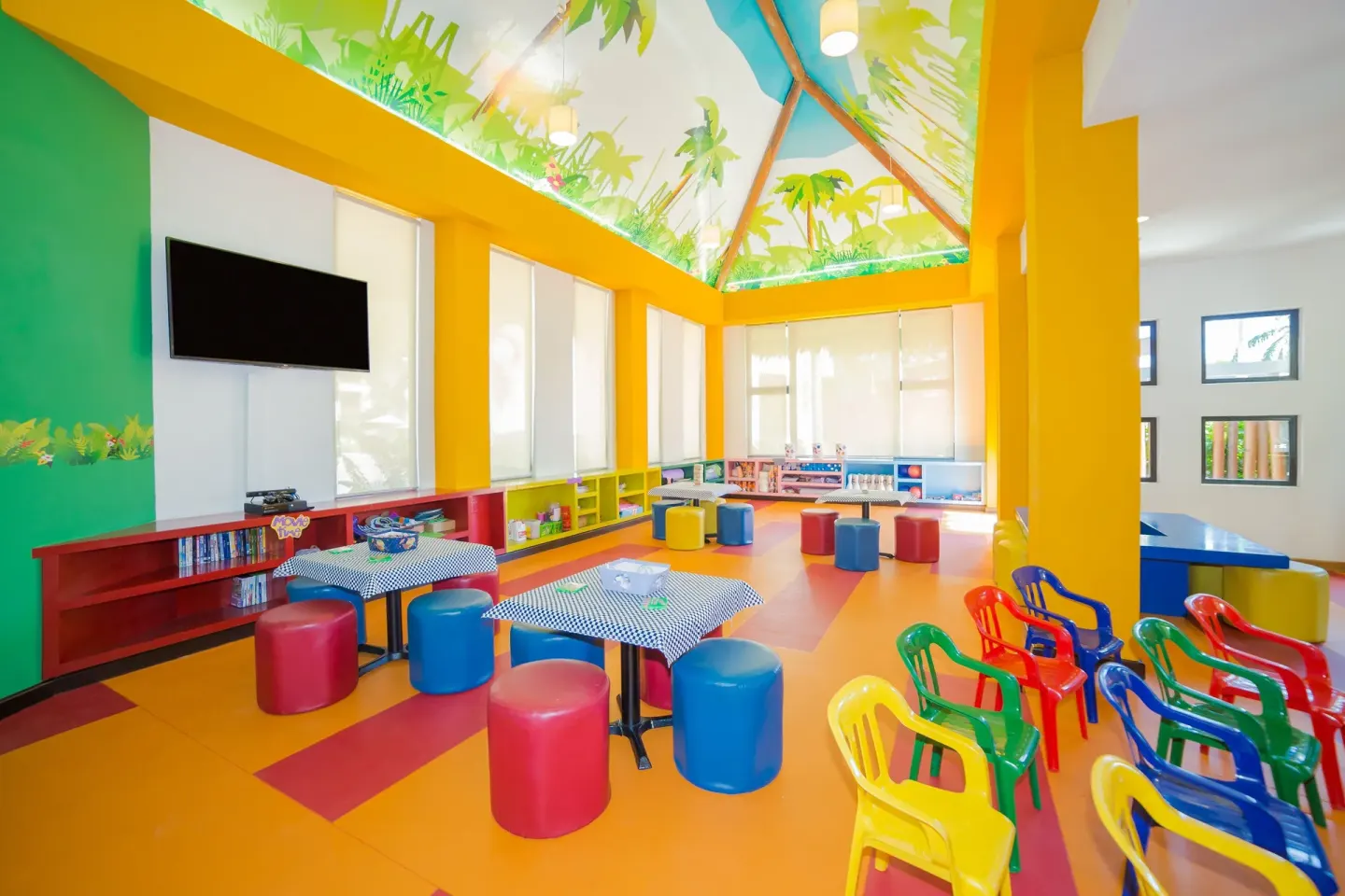 Colorful kids club playroom with small chairs at Villa del Palmar Cancun Beach Resort & Spa.