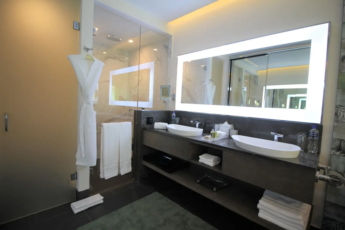Double vanity bathroom with glass shower at Villa del Palmar Cancun Beach Resort & Spa.