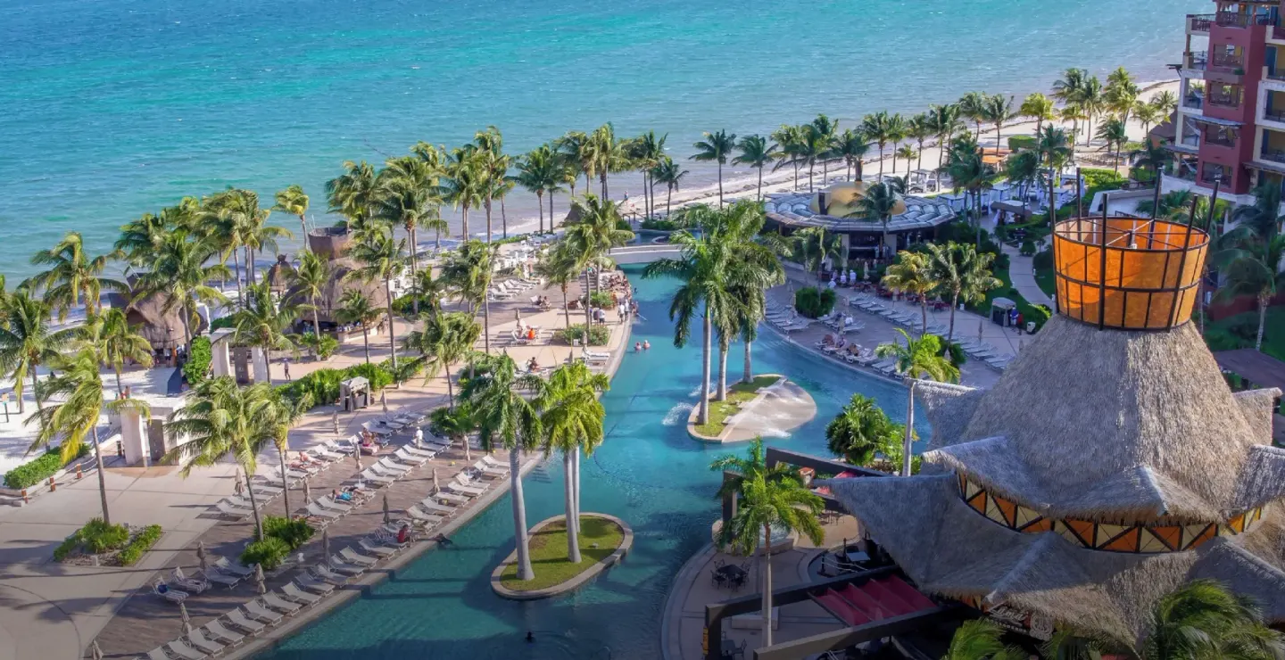 Lagoon-style pool beside the beach at Villa del Palmar Cancun Beach Resort & Spa.