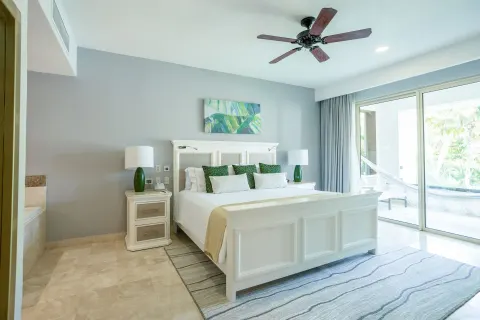 One Bedroom king bed and balcony doors at Villa del Palmar Cancun Beach Resort & Spa.