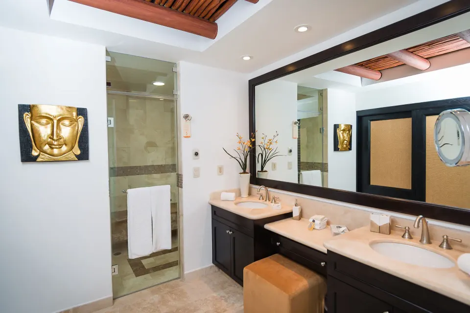 Two Bedroom Loft bathroom with double vanity and glass shower at Villa del Palmar Cancun Beach Resort & Spa.