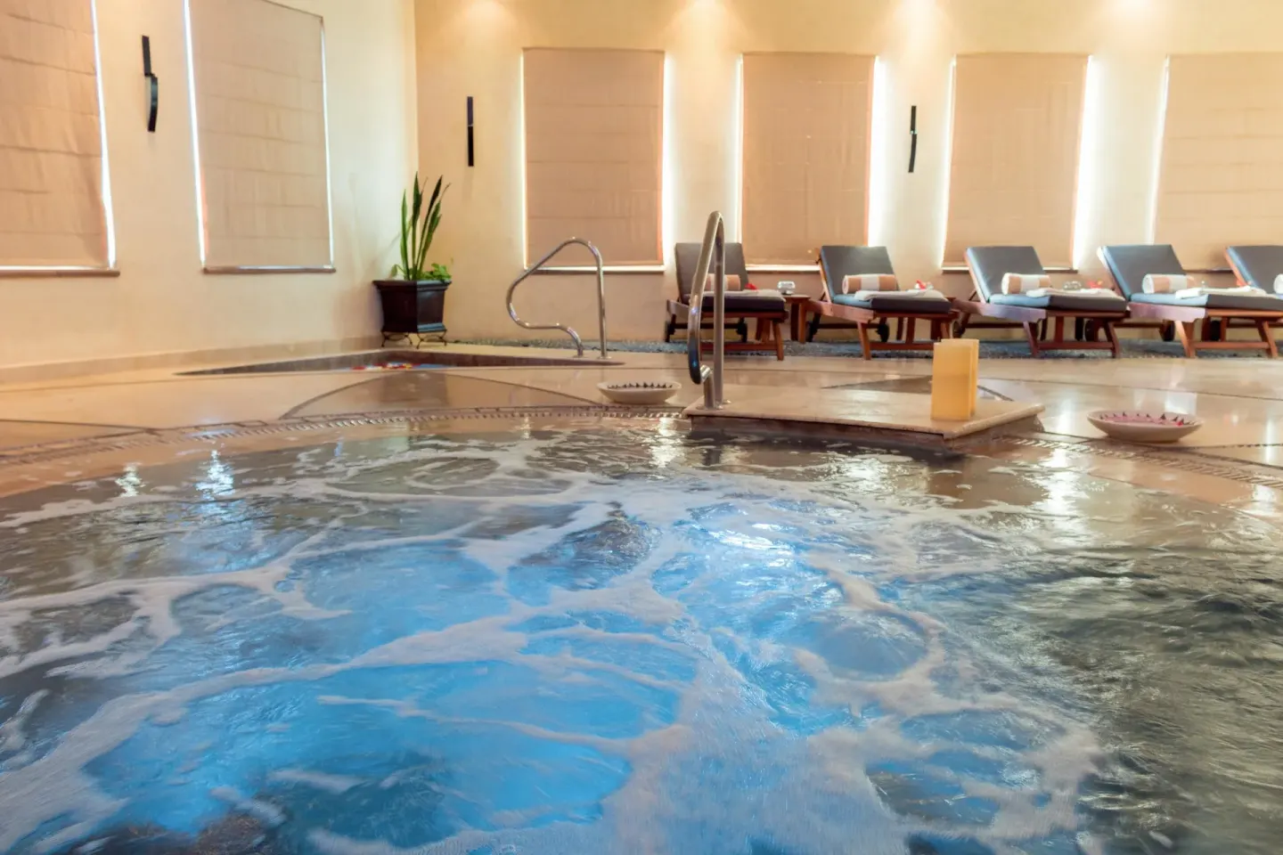 Close view of indoor spa pool and loungers at Villa Del Palmar Flamingos Beach Resort and Spa.