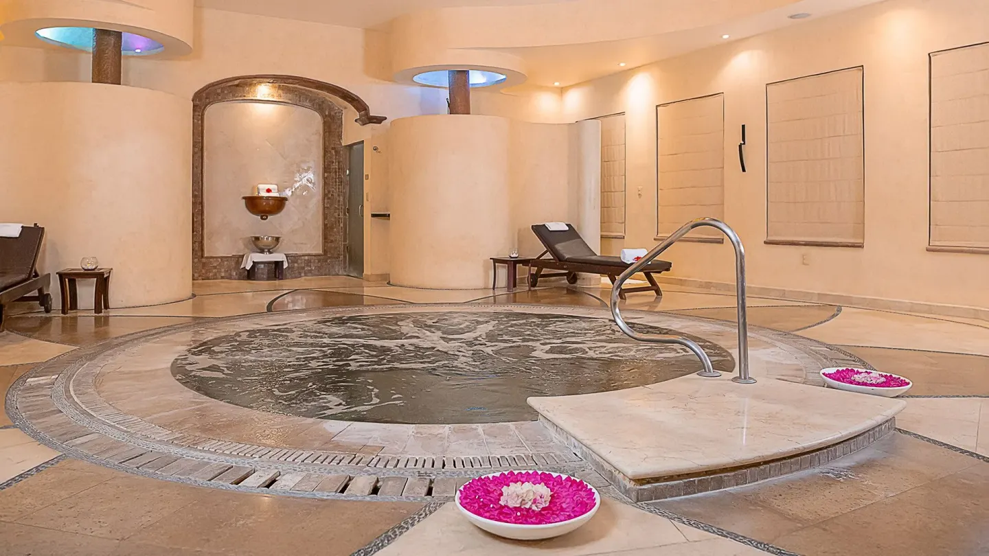 Indoor spa whirlpool with loungers at Villa Del Palmar Flamingos Beach Resort and Spa.