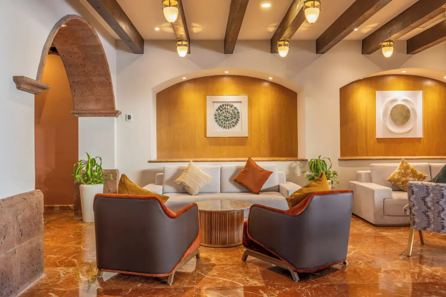 Lounge seating beneath wood beams at Villa Del Palmar Flamingos Beach Resort and Spa.