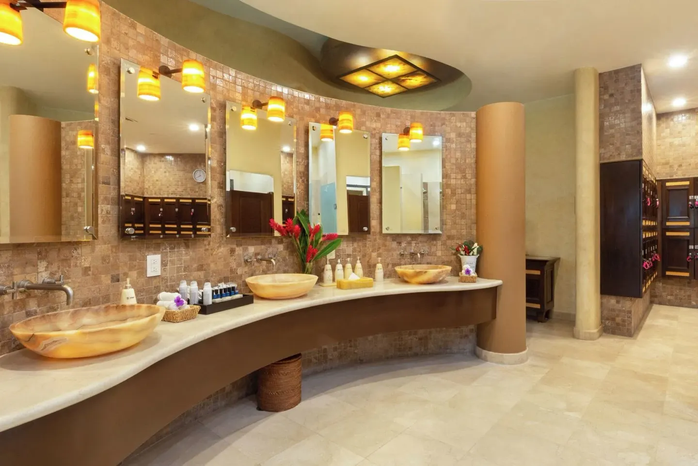 Spa locker room vanity with mirrors and vessel sinks at Villa Del Palmar Flamingos Beach Resort and Spa.