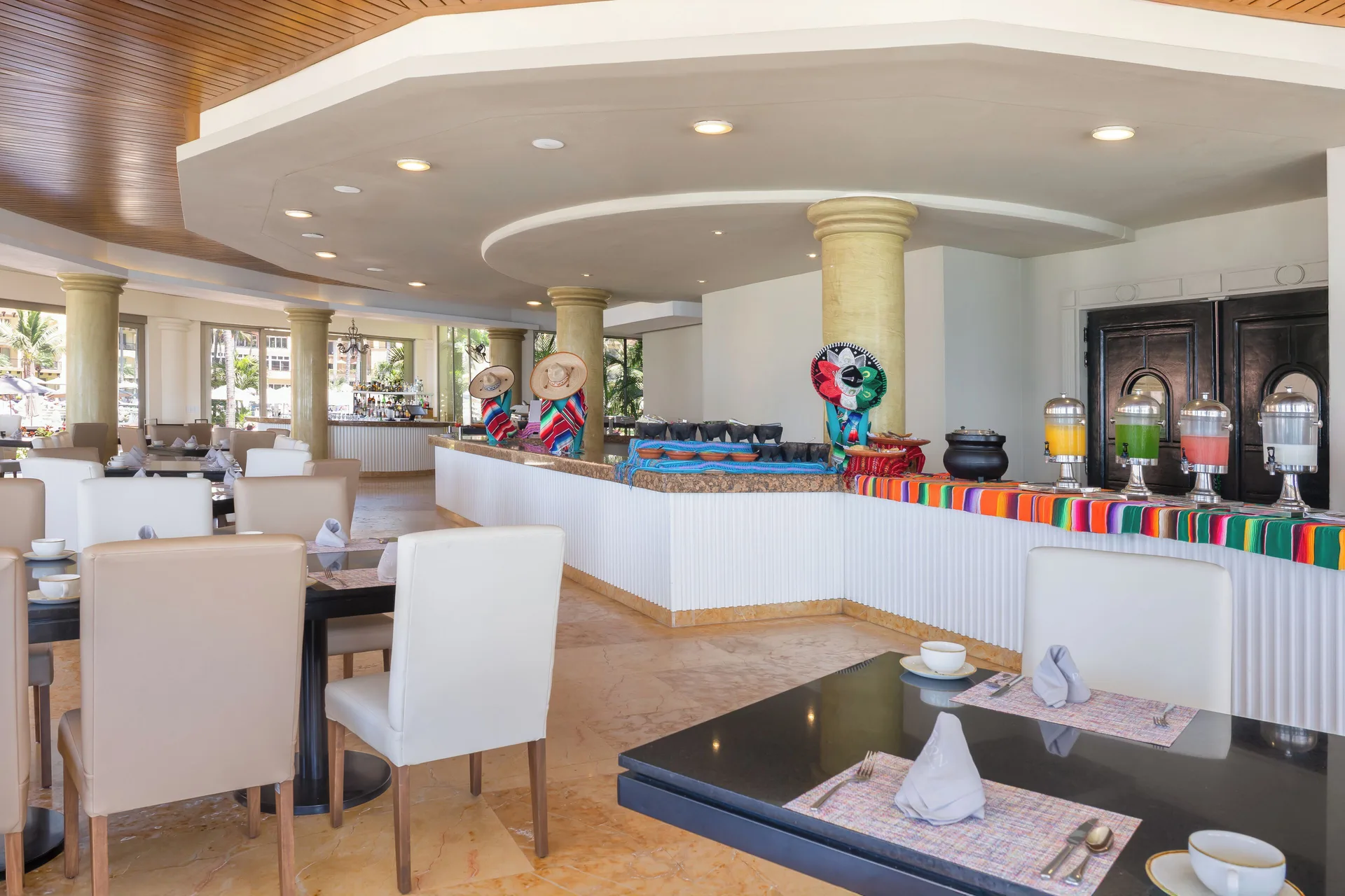 Buffet dining room with colorful linens at Villa Del Palmar Flamingos Beach Resort and Spa.