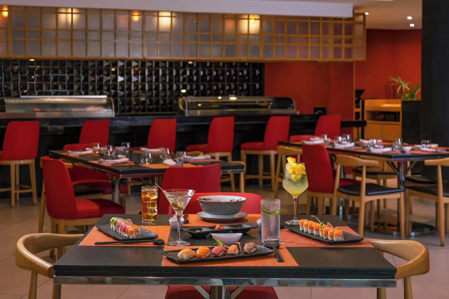 Sushi and cocktails on a Japanese restaurant table at Villa Del Palmar Flamingos Beach Resort and Spa.