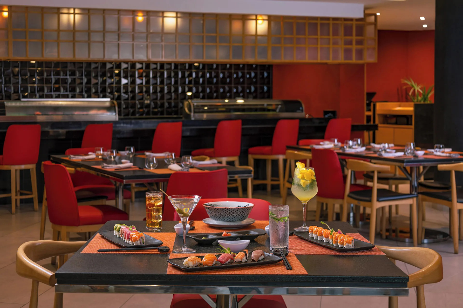 Sushi and cocktails on a Japanese restaurant table at Villa Del Palmar Flamingos Beach Resort and Spa.
