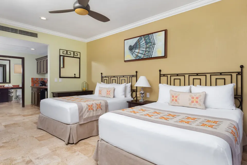 Junior Suite with two beds and kitchenette at Villa Del Palmar Flamingos Beach Resort and Spa.