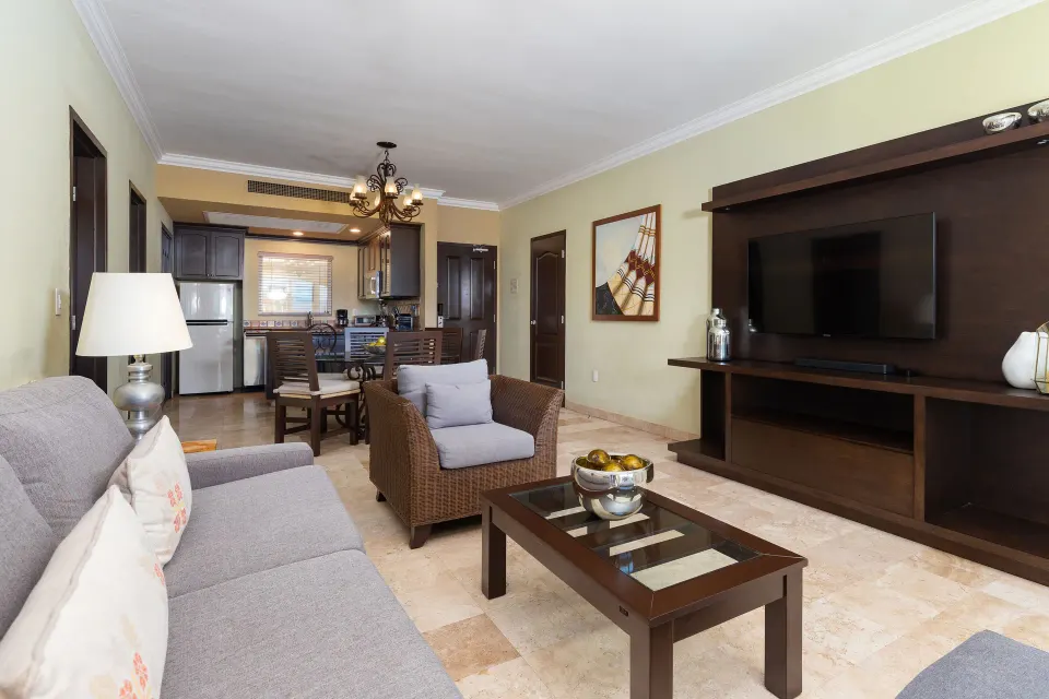 One Bedroom Suite living room with sofa and TV at Villa Del Palmar Flamingos Beach Resort and Spa.
