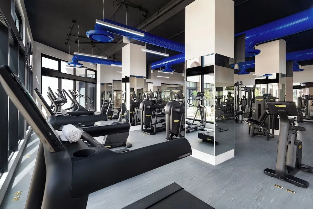 Fitness center with treadmills and strength machines at Villa La Valencia Los Cabos Beach Resort & Spa.