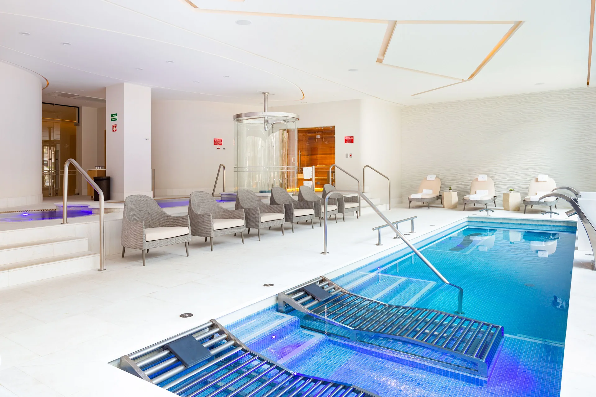Indoor hydrotherapy pool and lounge chairs at Villa La Valencia Los Cabos Beach Resort & Spa.