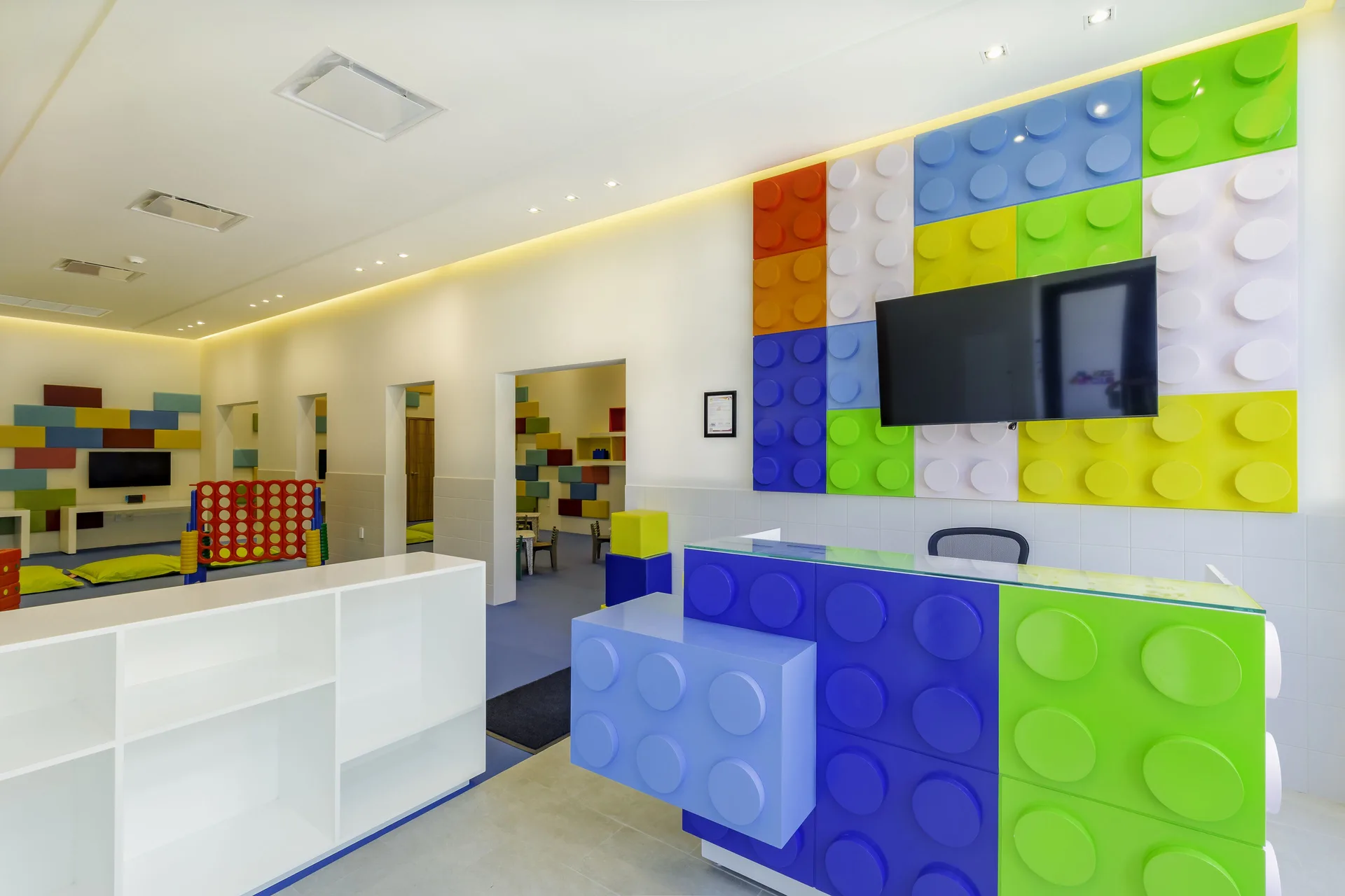 Kids club front desk with colorful block-style decor at Villa La Valencia Los Cabos Beach Resort & Spa.