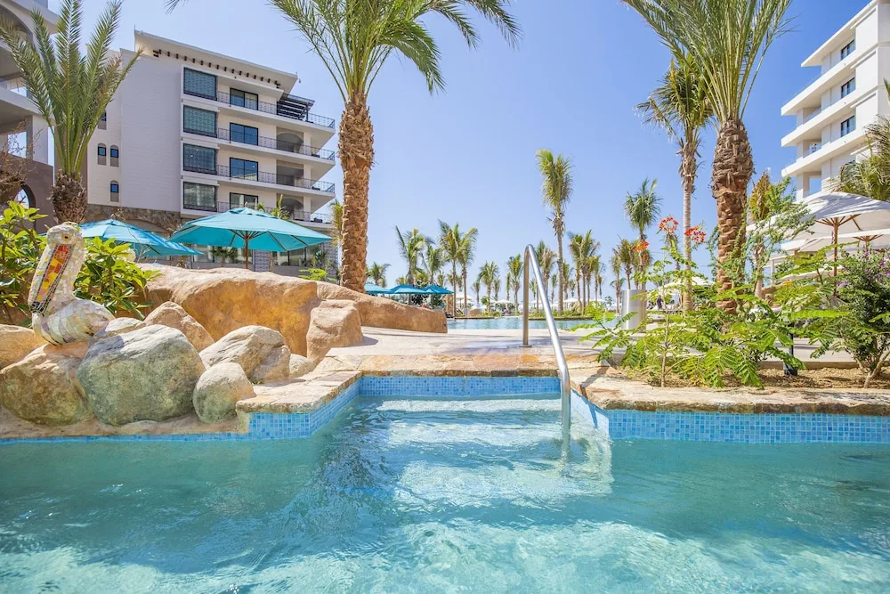 Pool steps and palms in the resort grounds at Villa La Valencia Los Cabos Beach Resort & Spa.