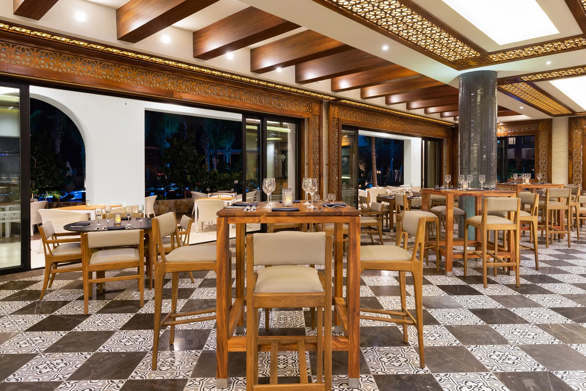 Restaurant dining room with patterned tile floors at Villa La Valencia Los Cabos Beach Resort & Spa.