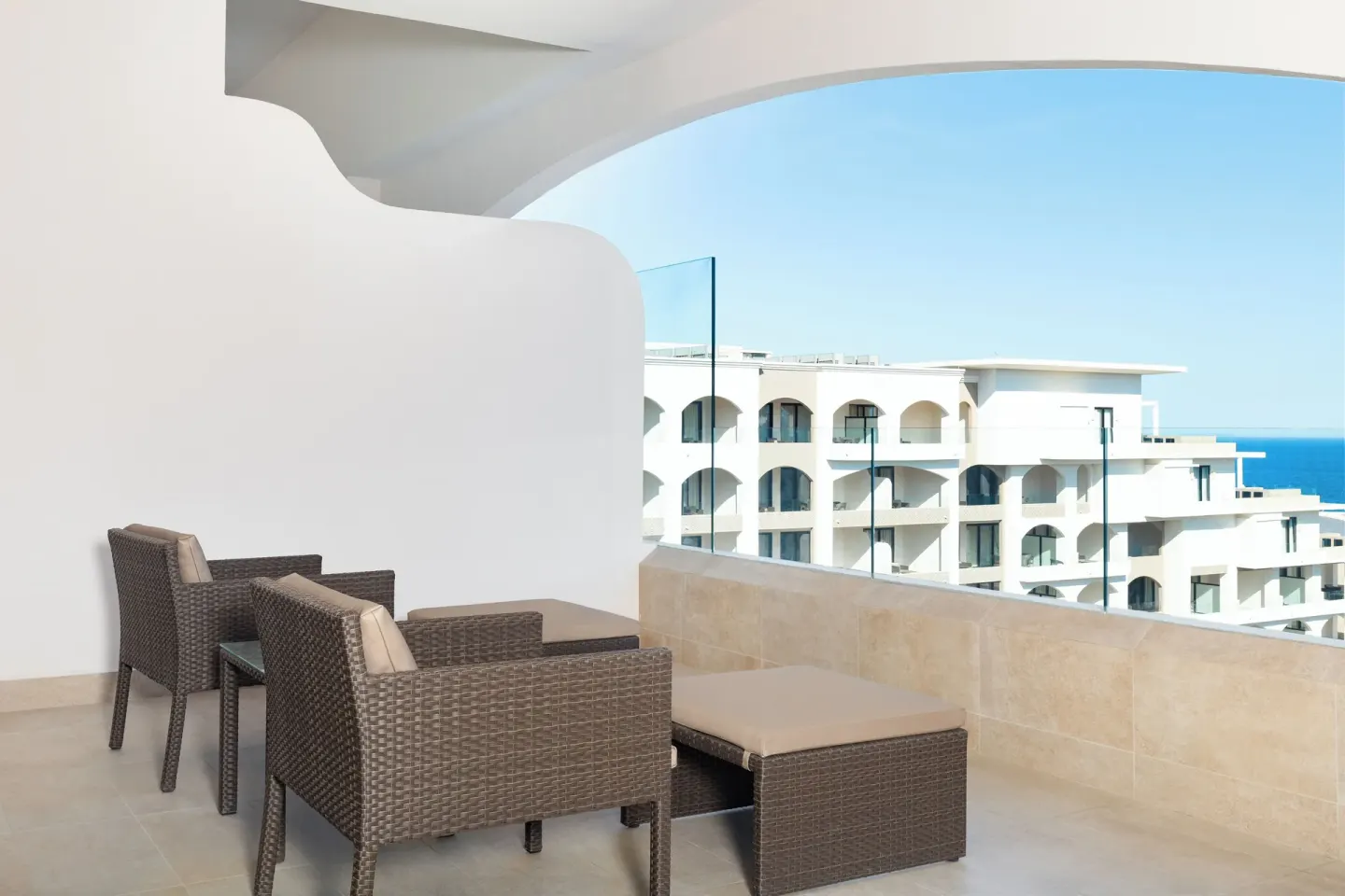 Ocean-view balcony seating for a Deluxe Studio at Villa La Valencia Los Cabos Beach Resort & Spa.