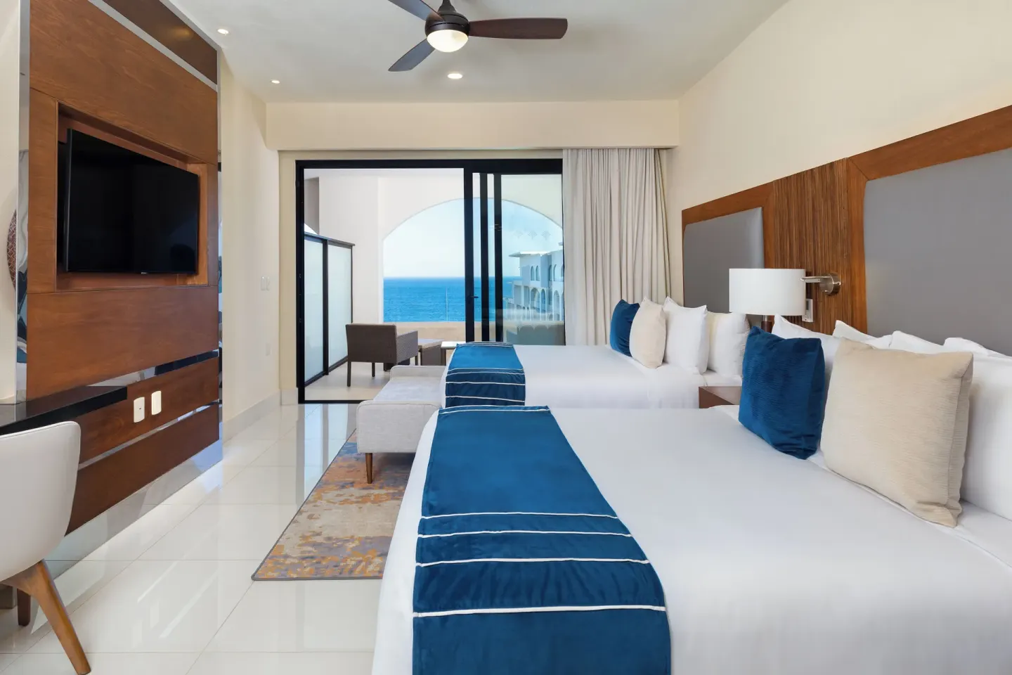 Deluxe Studio Ocean View with two beds and balcony at Villa La Valencia Los Cabos Beach Resort & Spa.