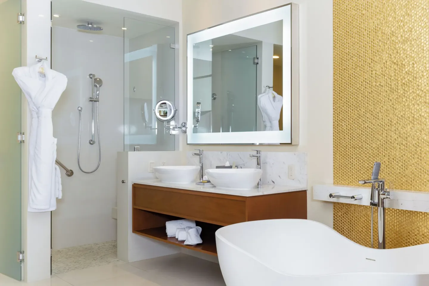 Deluxe Studio bathroom with freestanding tub and glass shower at Villa La Valencia Los Cabos Beach Resort & Spa.