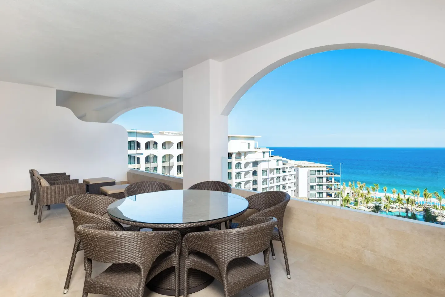 One Bedroom Suite Ocean View balcony dining area at Villa La Valencia Los Cabos Beach Resort & Spa.