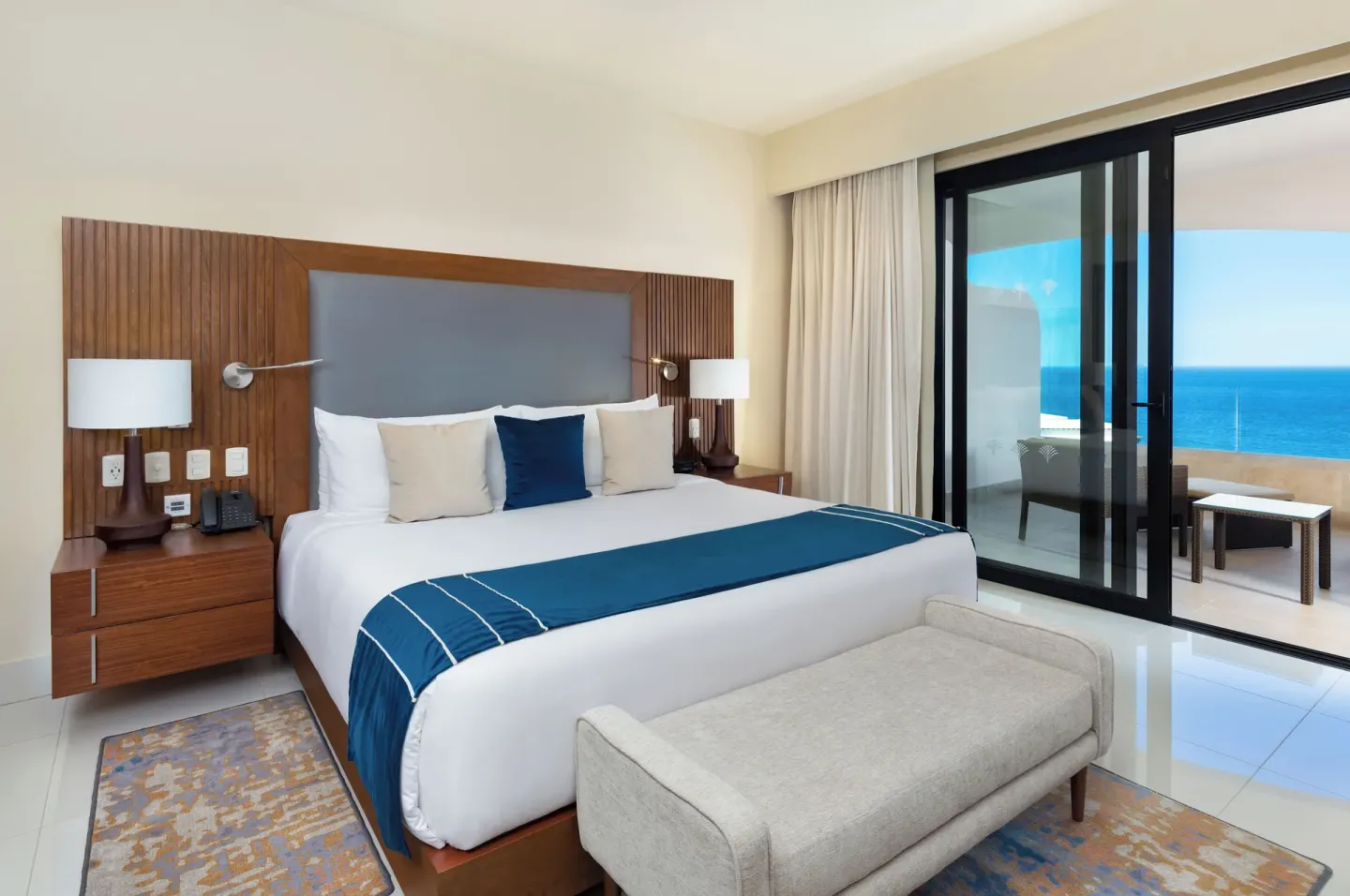 One Bedroom Suite Ocean View king bed and balcony at Villa La Valencia Los Cabos Beach Resort & Spa.