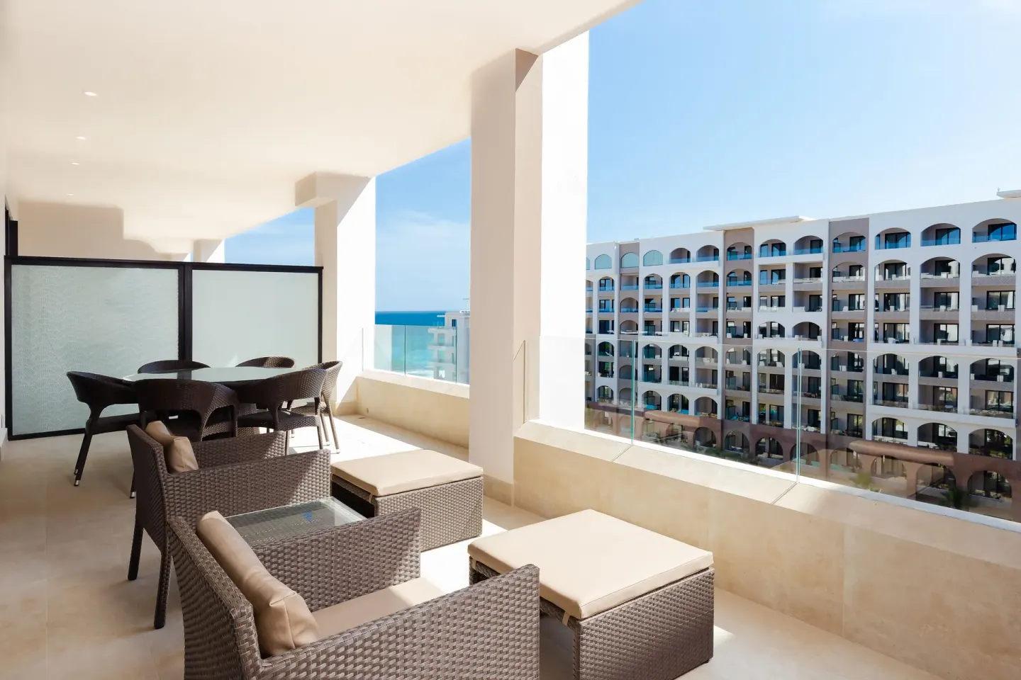 One Bedroom Suite Pool View balcony at Villa La Valencia Los Cabos Beach Resort & Spa with seating and resort views.