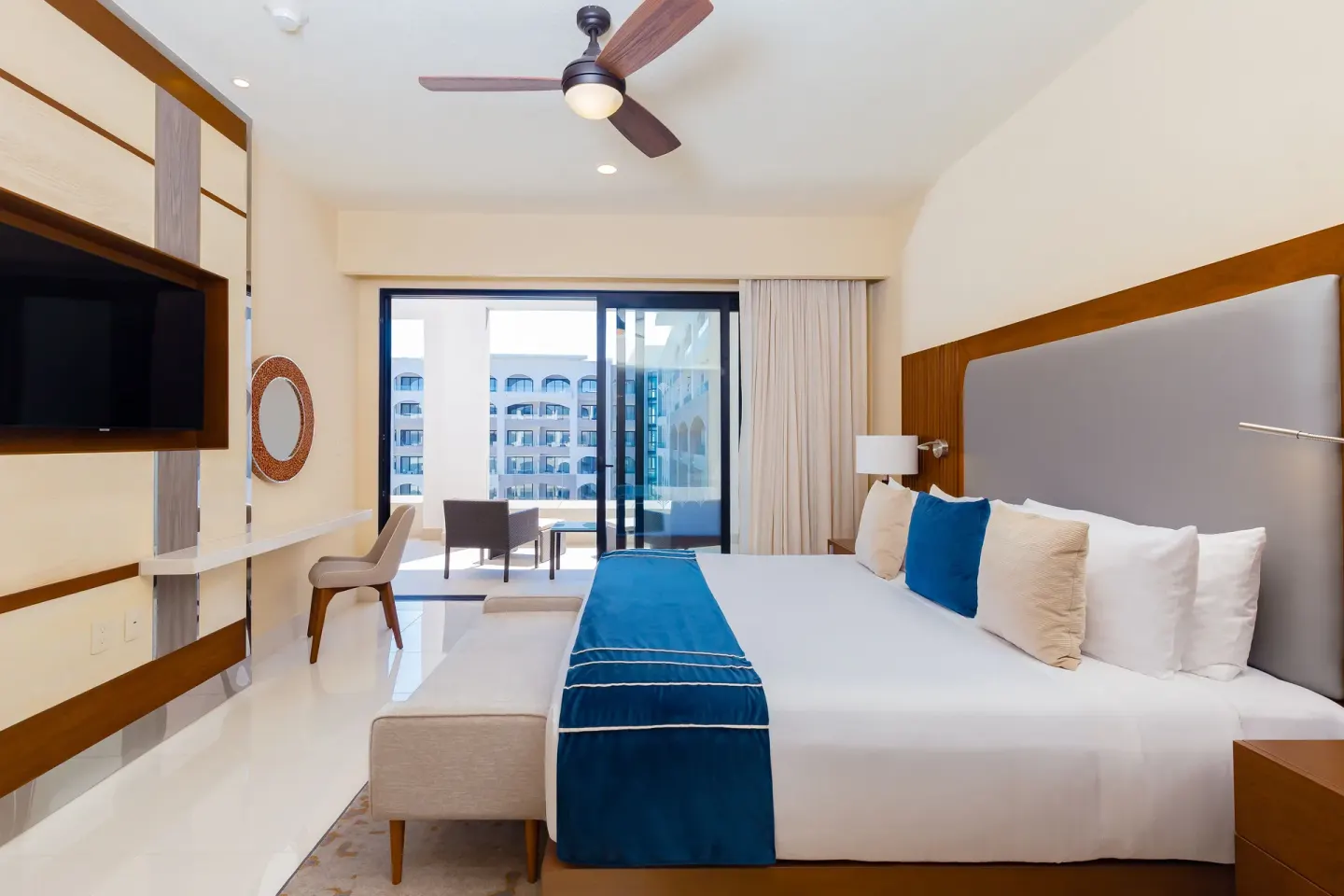 One Bedroom Suite Pool View bedroom with balcony at Villa La Valencia Los Cabos Beach Resort & Spa.
