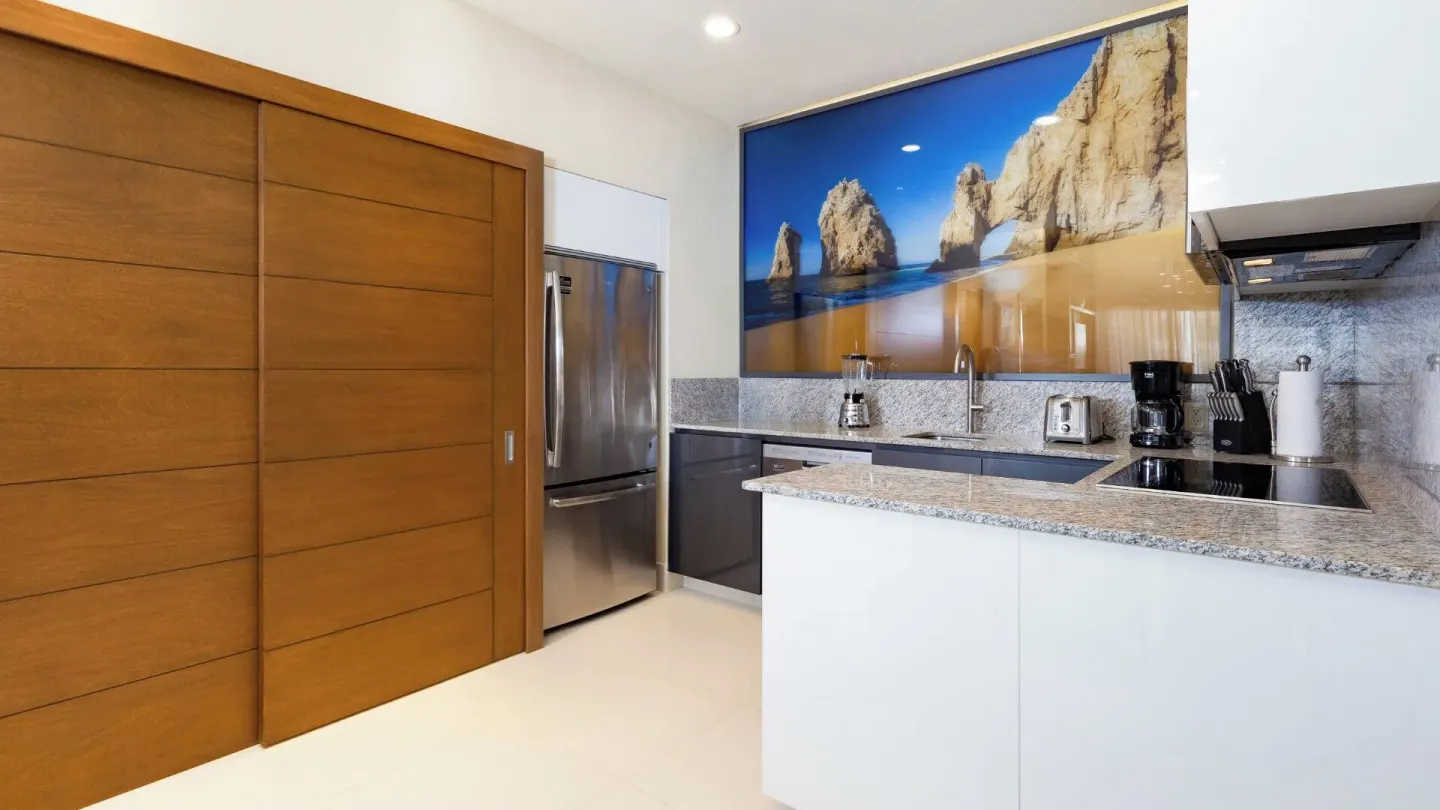 Kitchen counter and refrigerator in a One Bedroom Suite Pool View at Villa La Valencia Los Cabos Beach Resort & Spa.